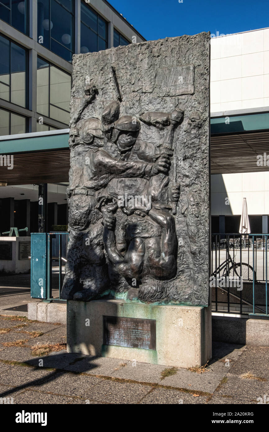 Relief sculptural artwork, The Death of the Demonstrator by Alfred Hrdlicka outside the Deutsche Oper Opera house in Charlottenburg-Berlin Stock Photo