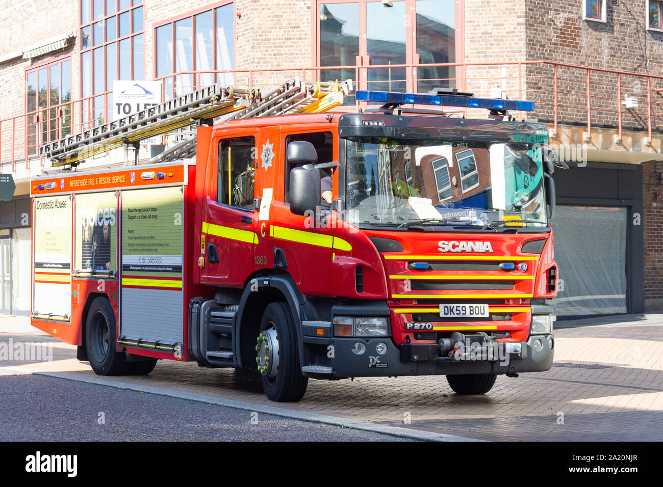 Merseyside Fire engine on call, Ormskirk Street, St Helens, Merseyside, England, United Kingdom Stock Photo