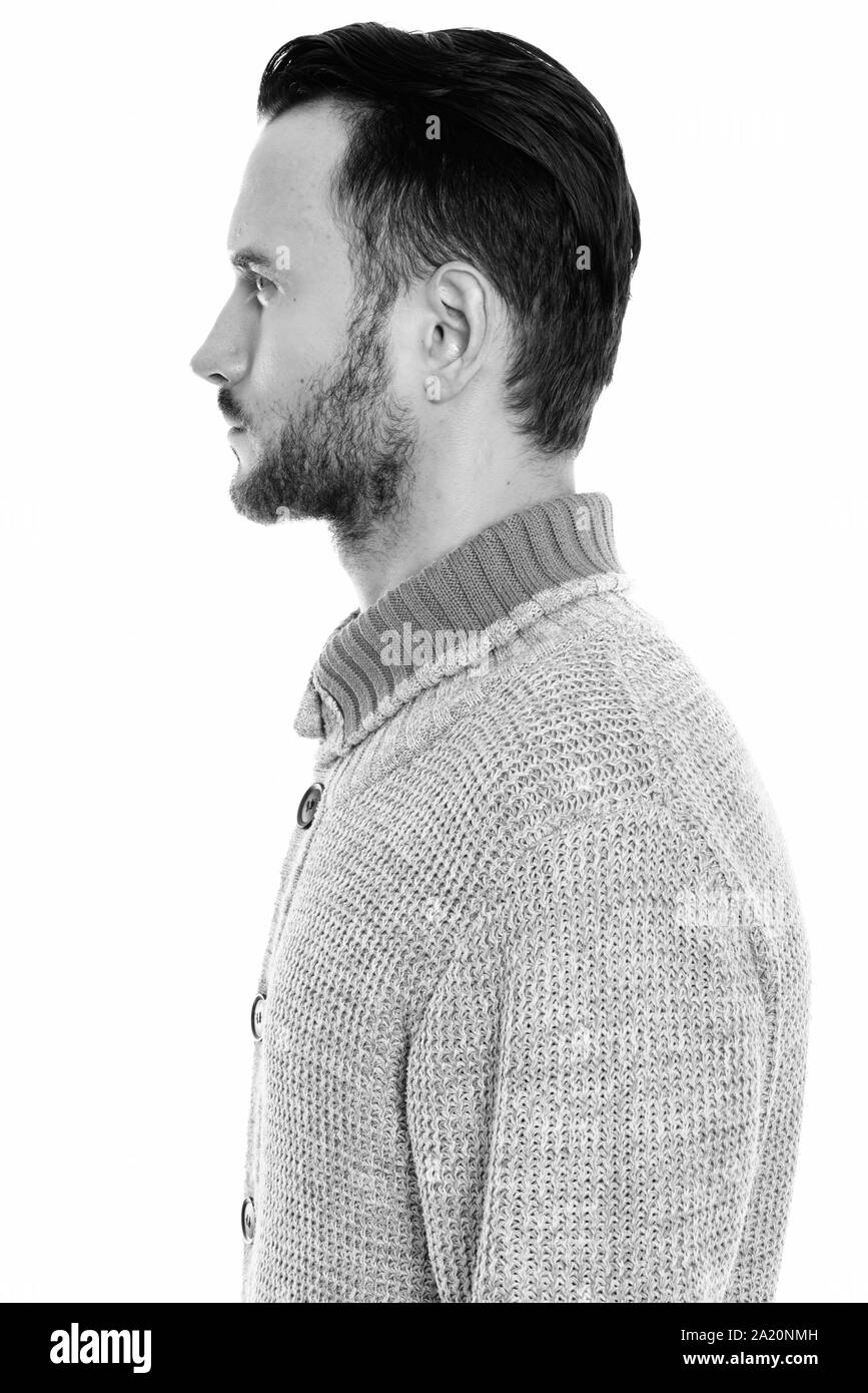 Profile view of young man wearing knitted sweater Stock Photo