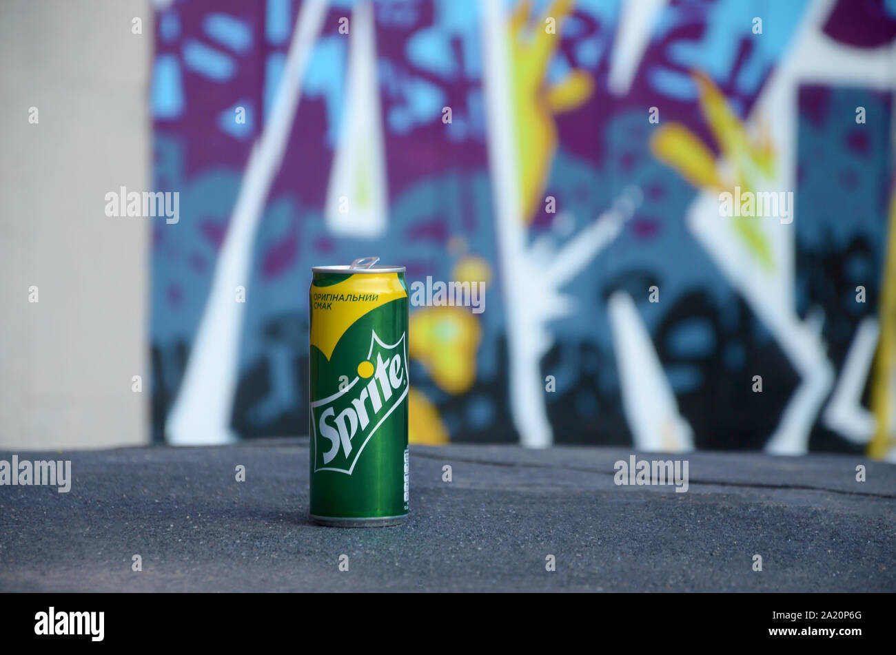 KHARKOV, UKRAINE - AUGUST 24, 2019: Sprite can on blurred colorful ...