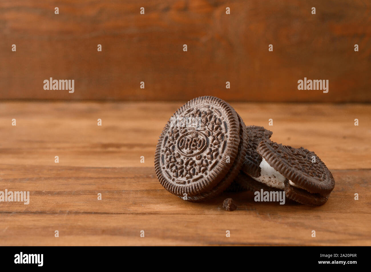 KHARKOV, UKRAINE - SEPTEMBER 8, 2019: Many OREO sandwich cream biscuits on wooden background. Oreo is a sandwich cookie with a sweet cream is the best Stock Photo