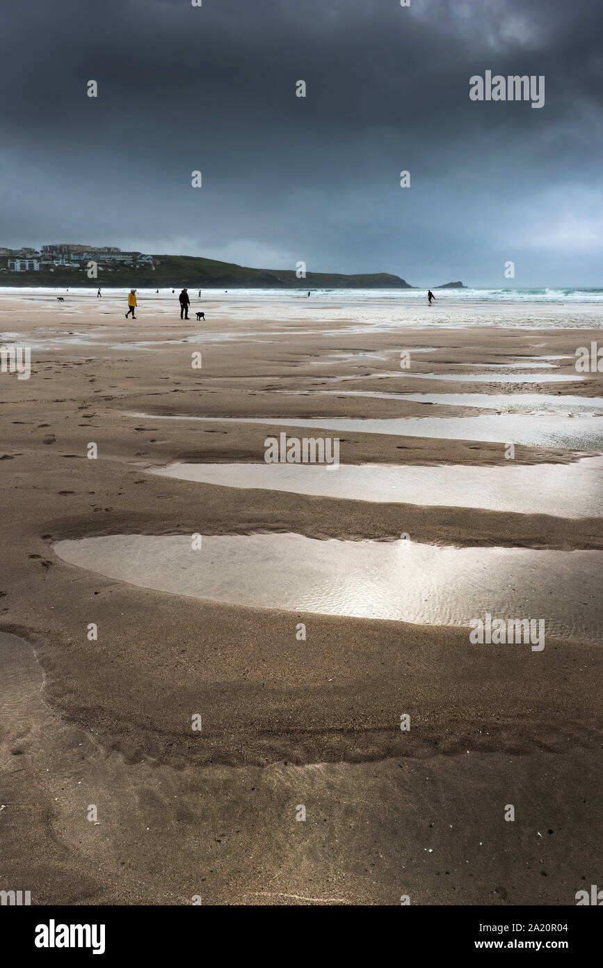 Dark dramatic chilly autumnal weather over Fistral Beach in Newquay in Cornwall. Stock Photo