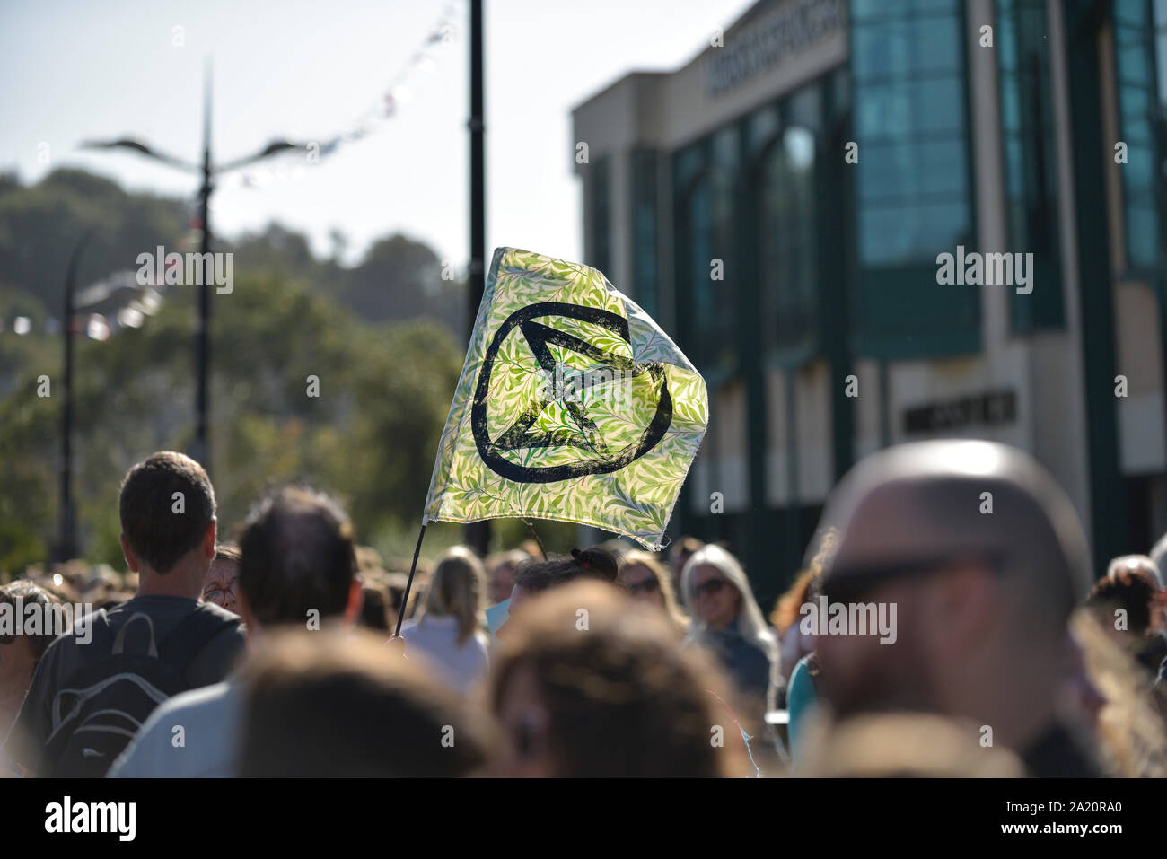 An Extinction Rebellion flag flying at the Extinction Rebellion climate strike in Truro City City in Cornwall. Stock Photo
