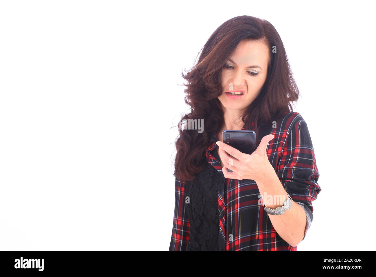 Emotional woman with smart phone - happy, angry Stock Photo