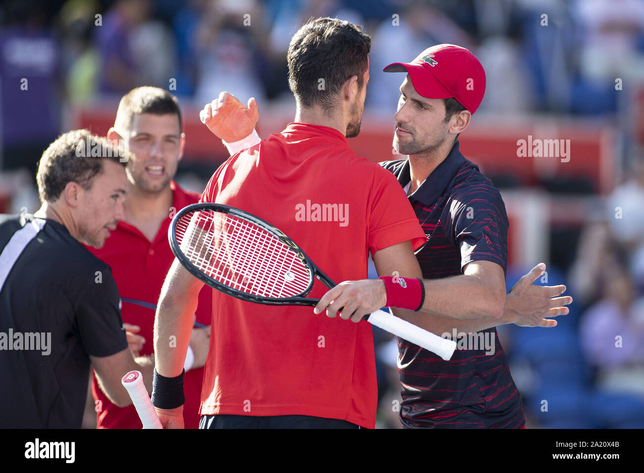 Tokyo, Japan. 30th Sep, 2019. Filip Krajinovic (SRB) and Novak Djokovic  (SRB) shake hands with Mate Pavic (CRO) and Bruno Soares (BRA) after lost  their first Men's Doubles match during the Rakuten