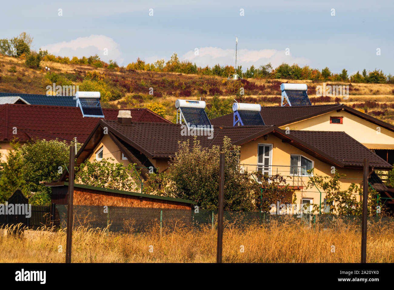 Solar water heaters on the roof top of houses Stock Photo - Alamy