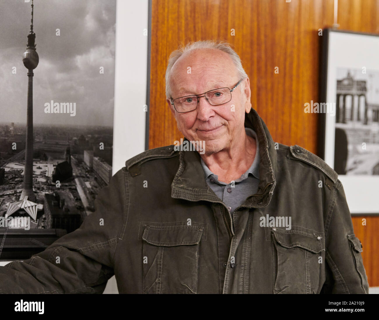 Berlin, Germany. 30th Sep, 2019. Thomas Billhardt, photographer, stands in front of his historical pictures in the television tower. On 3 October 1969, the state leadership of the GDR ceremoniously opened the Berlin Television Tower on the occasion of its 50th birthday. Credit: Annette Riedl/dpa/Alamy Live News Stock Photo