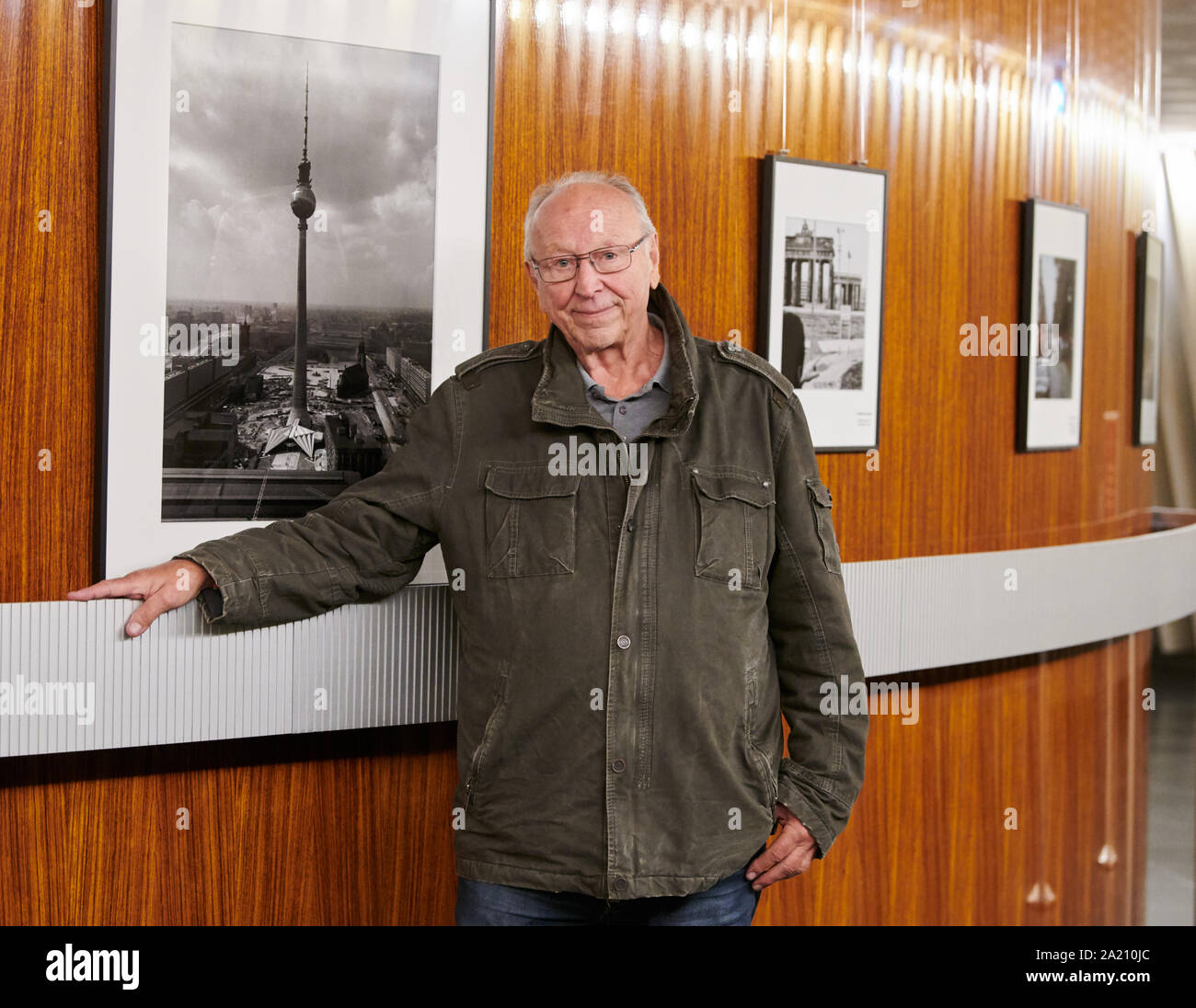 Berlin, Germany. 30th Sep, 2019. Thomas Billhardt, photographer, stands in front of his historical pictures in the television tower. On 3 October 1969, the state leadership of the GDR ceremoniously opened the Berlin Television Tower on the occasion of its 50th birthday. Credit: Annette Riedl/dpa/Alamy Live News Stock Photo