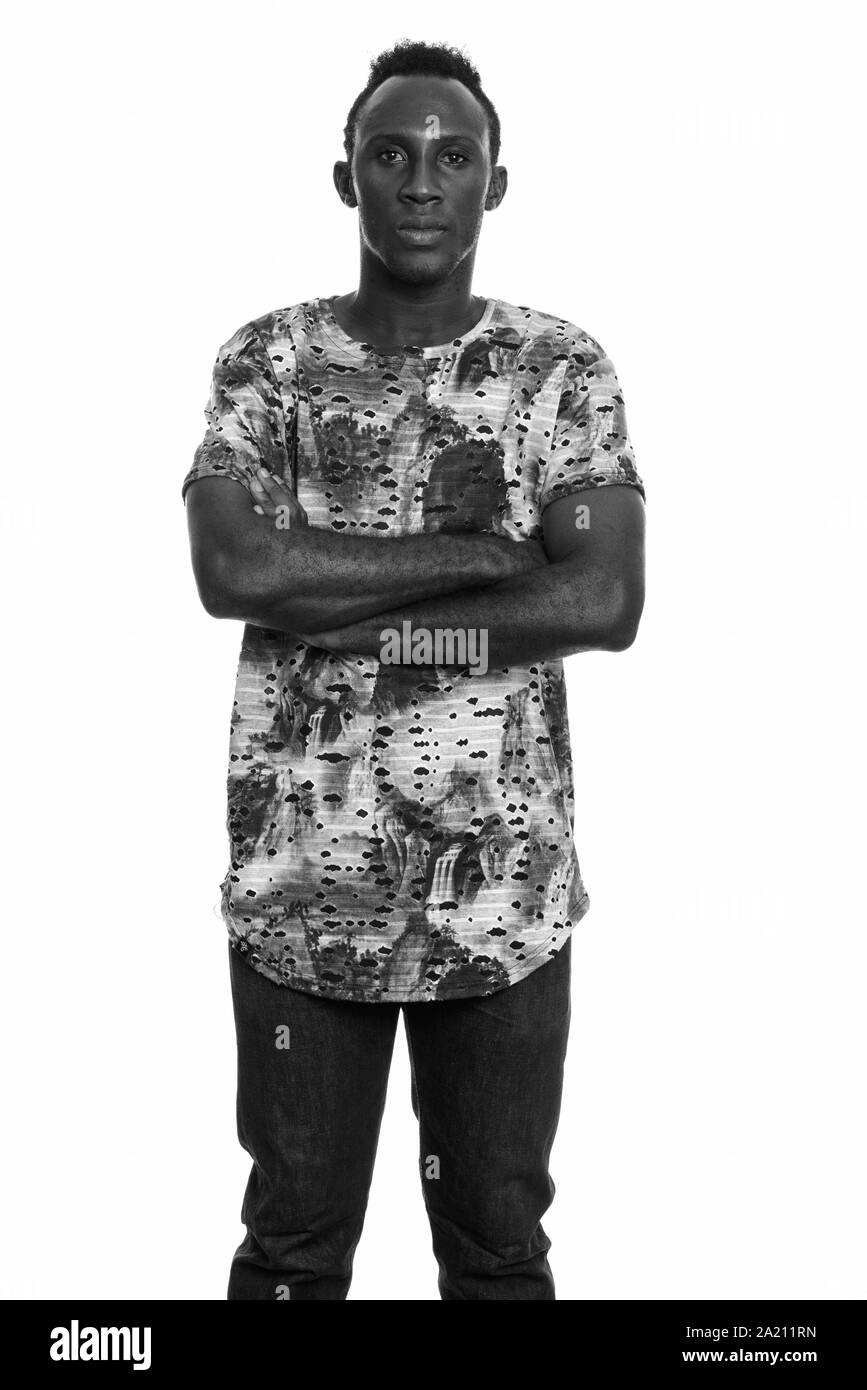 Young black African man with arms crossed Stock Photo - Alamy