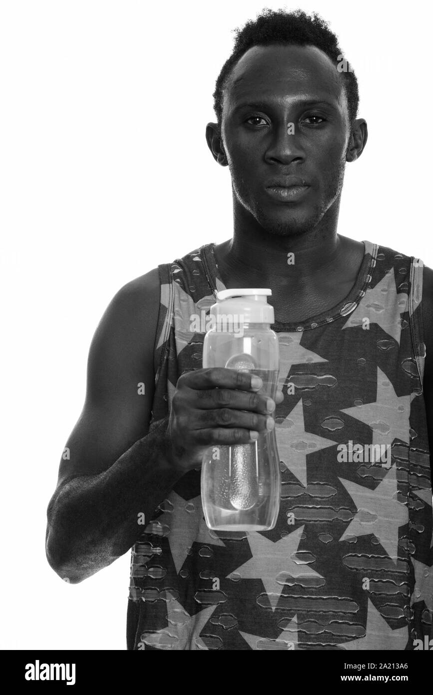 Young black African man holding water bottle Stock Photo