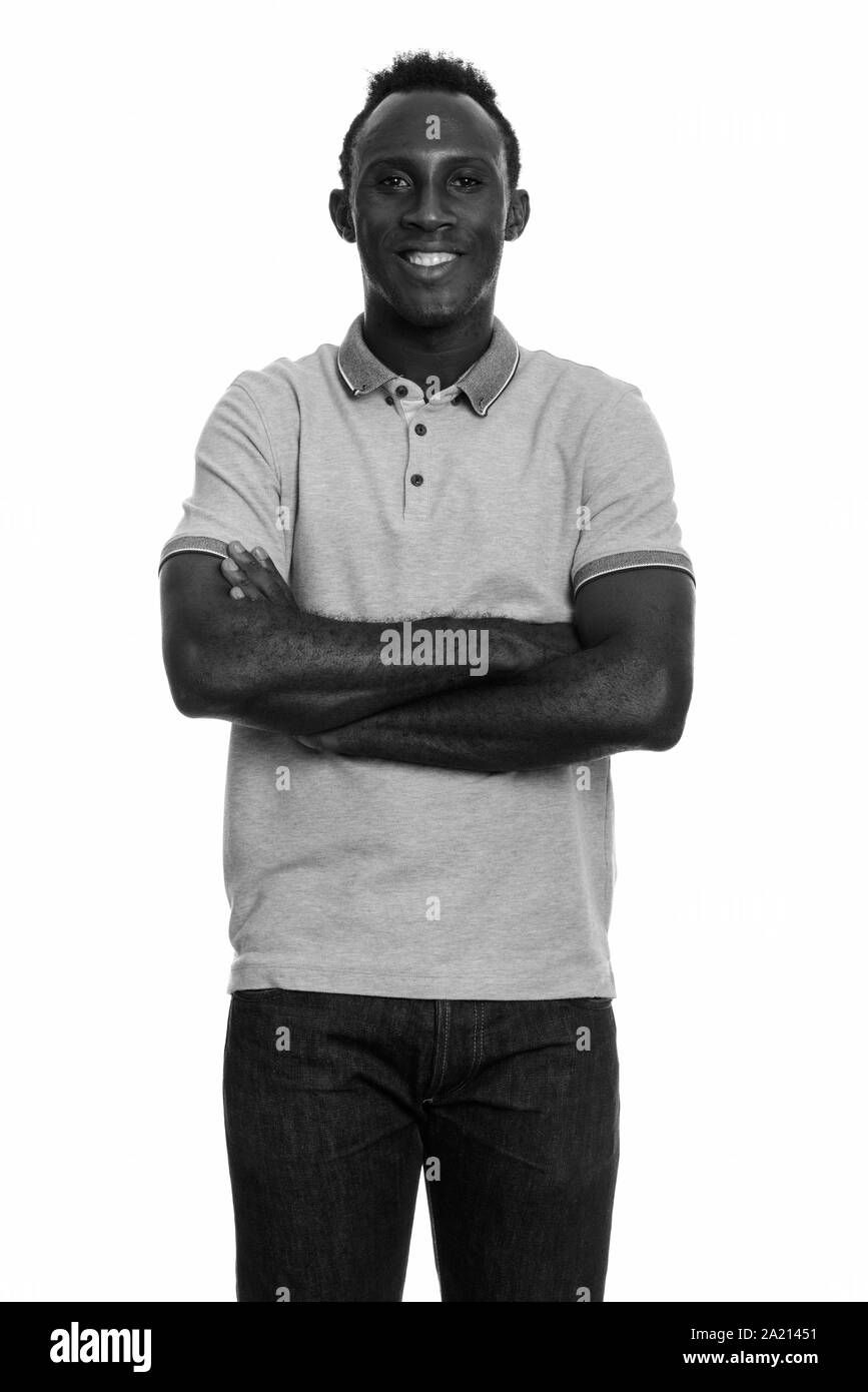 Young happy black African man smiling with arms crossed Stock Photo - Alamy