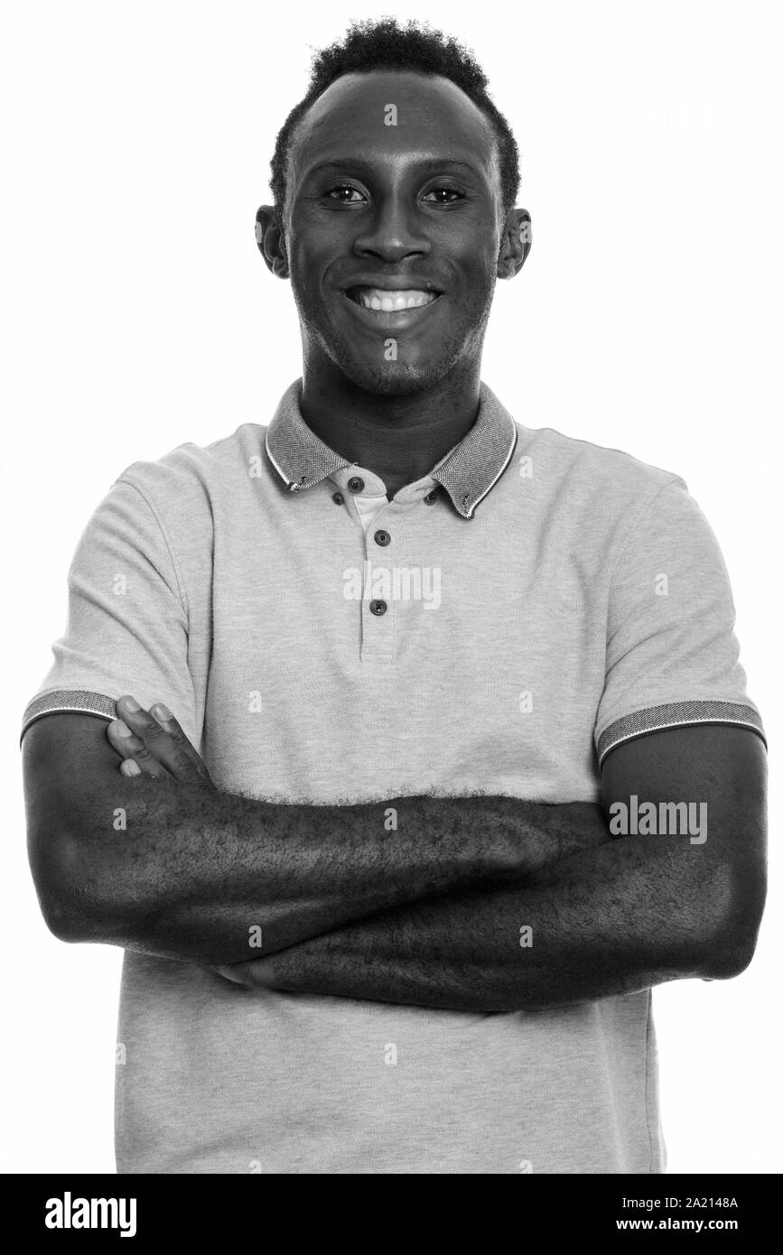 Young happy black African man smiling with arms crossed Stock Photo - Alamy