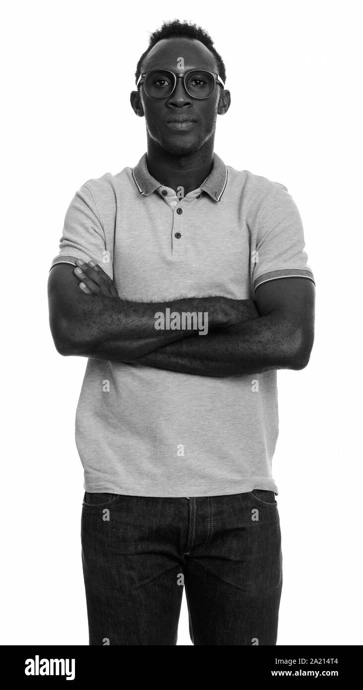 Young black African man with arms crossed Stock Photo - Alamy