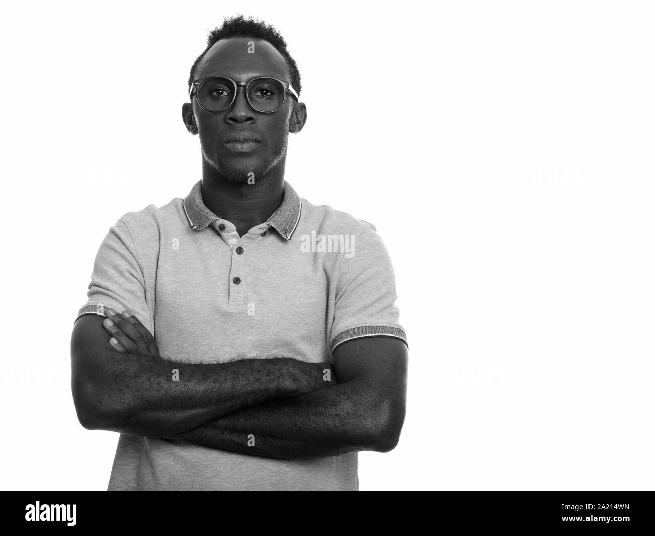 Young black African man with arms crossed Stock Photo - Alamy