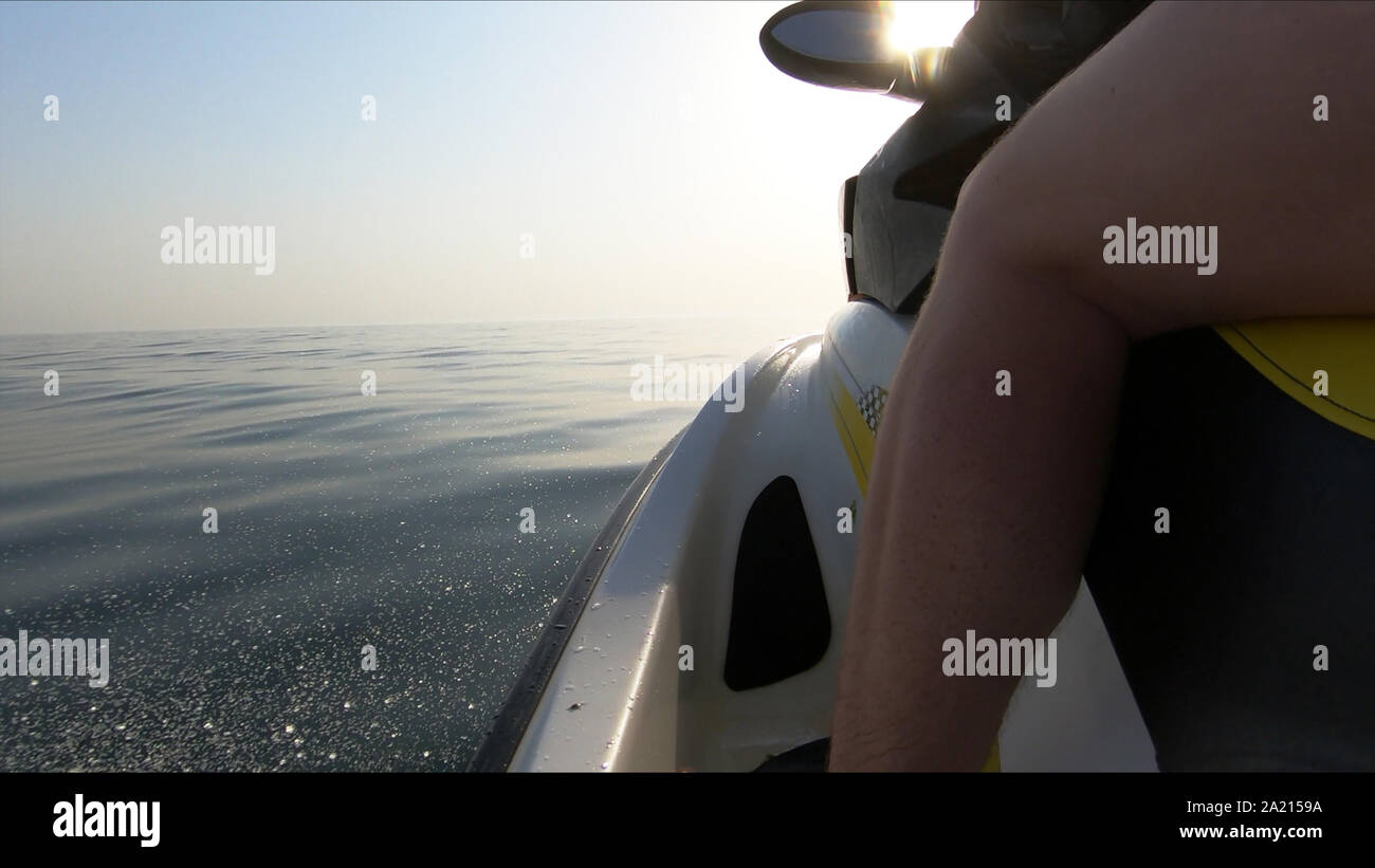Close up of person driving jet ski in the sea. Stock Photo