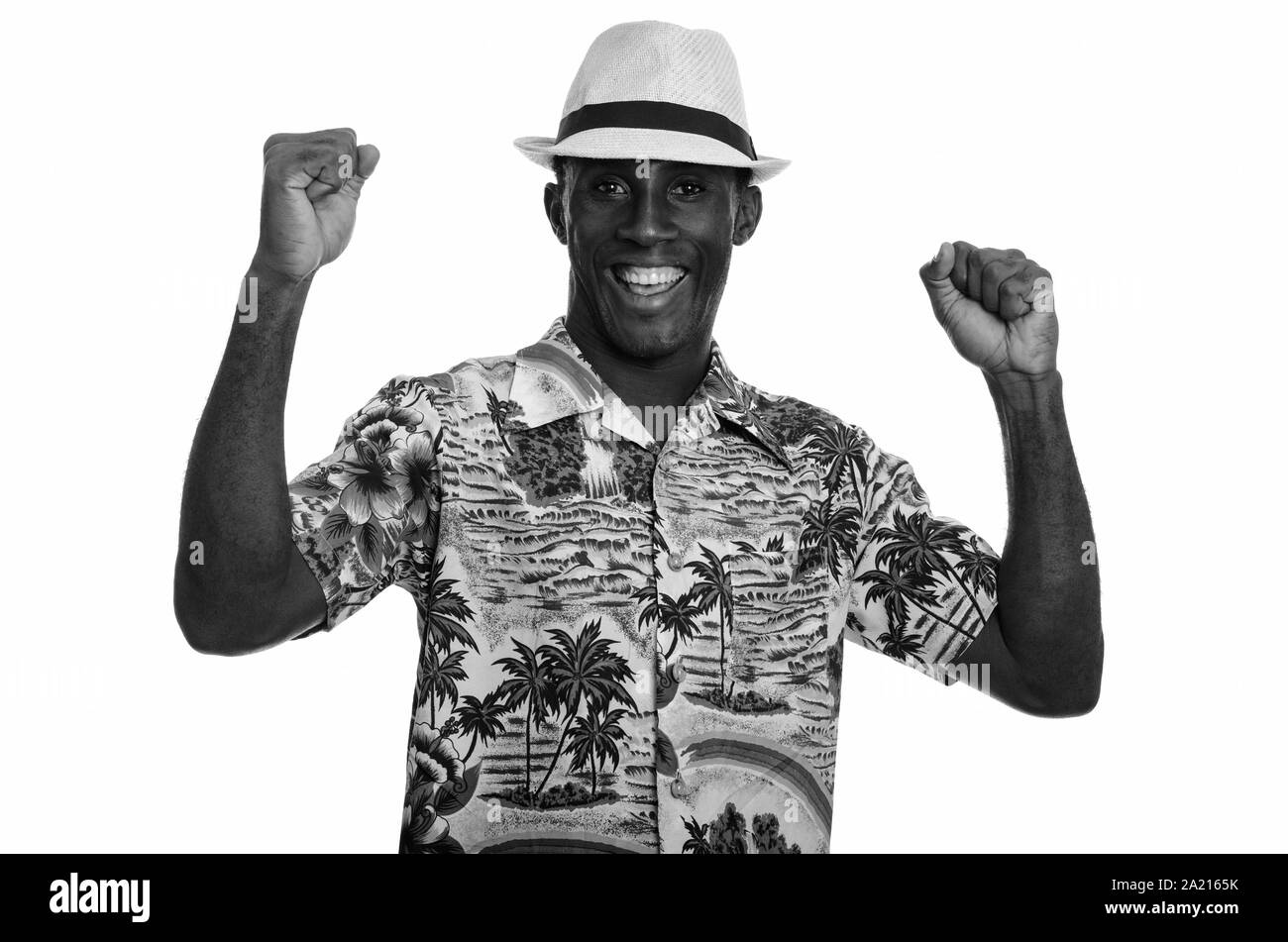 Young happy black African man smiling and looking excited Stock Photo