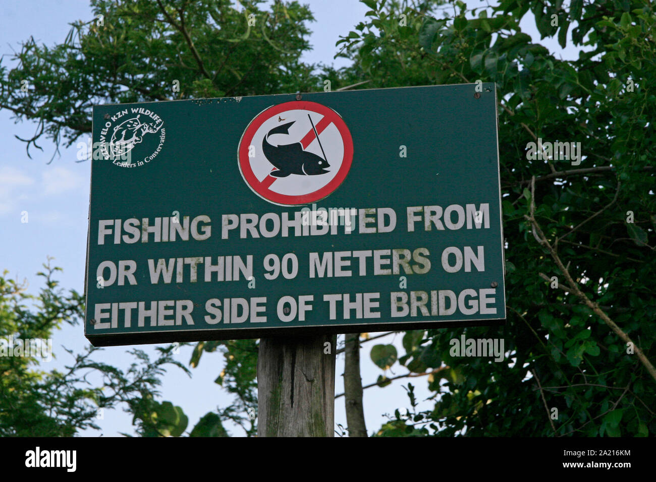 Sign prohibiting fishing around the R618 bridge, Lake St. Lucia Estuary entering St Lucia, Umkhanyakude District Municipality, KwaZulu Natal, South Africa. Stock Photo