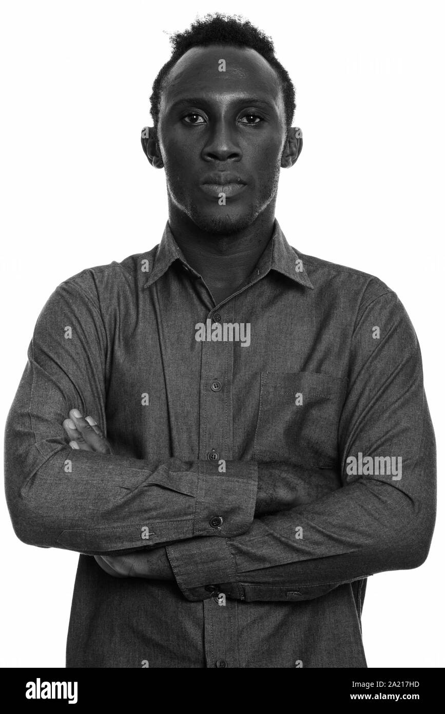 Young black African man with arms crossed Stock Photo - Alamy
