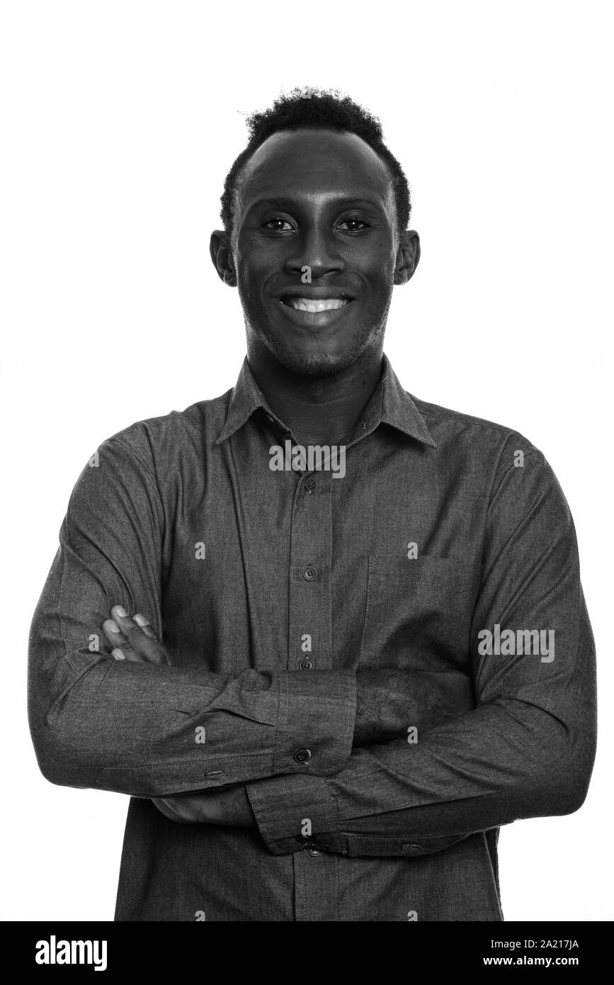 Young happy black African man smiling with arms crossed Stock Photo - Alamy