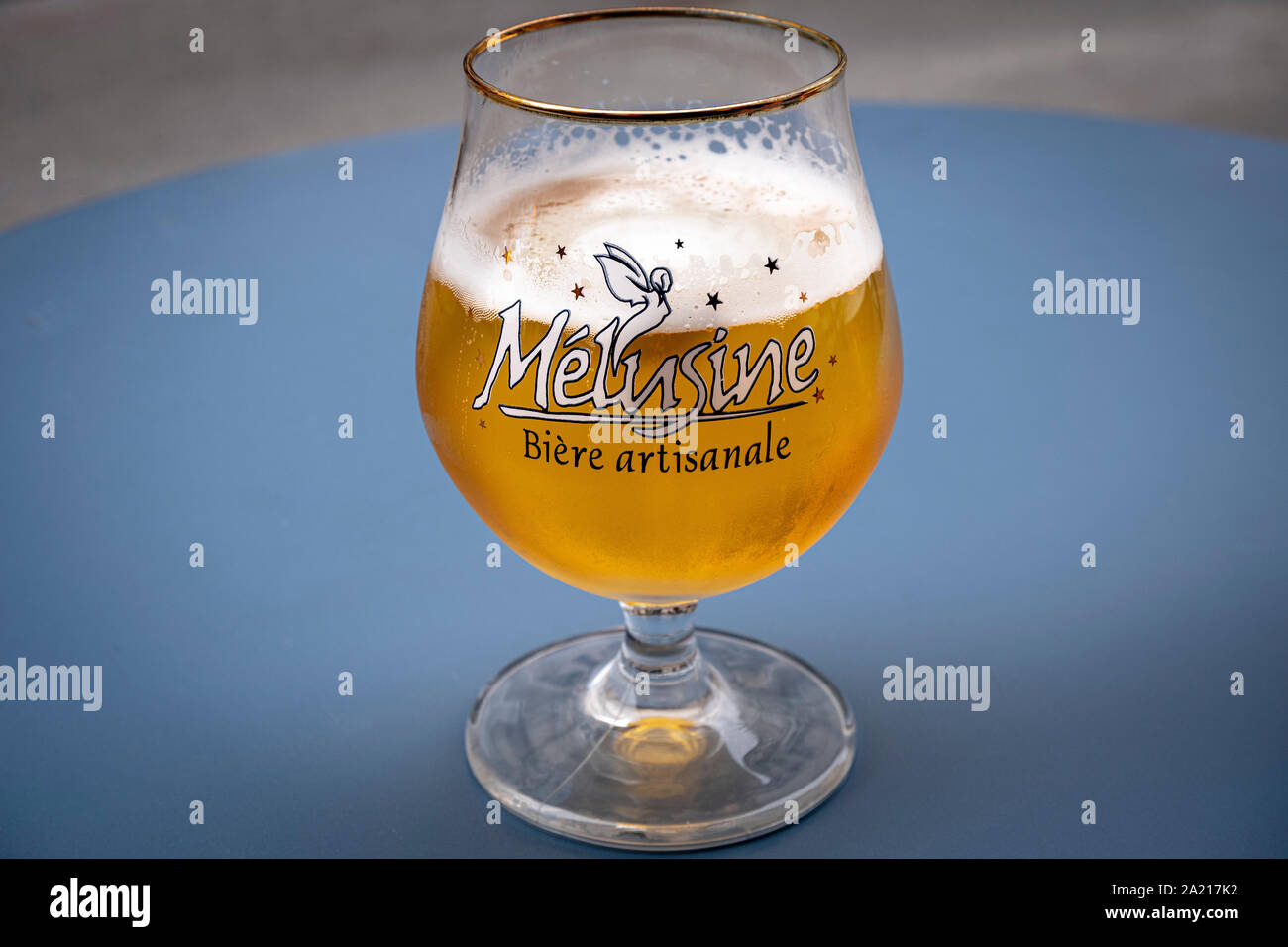 Half drunk beer, Melusine, biere artisinale, craft beer on blue table Stock  Photo - Alamy
