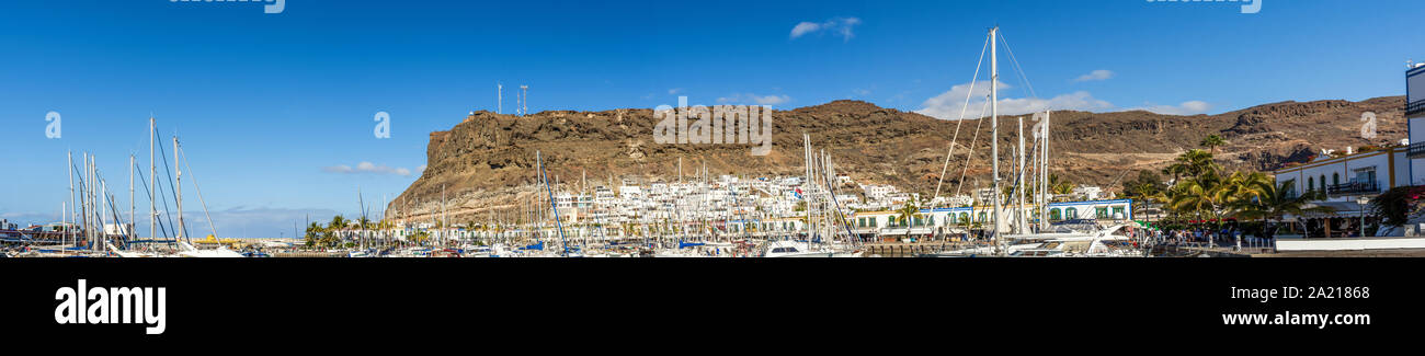 Panorama from the harbor of Puerto de Mogan with Los Gigantes in the background Stock Photo