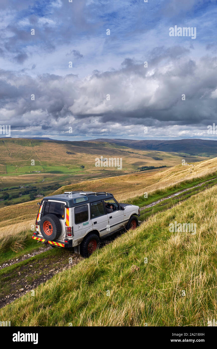 Car on West Cam Road, a section of the Pennine Way near Hawes. Yorkshire Dales National Park, England. Stock Photo