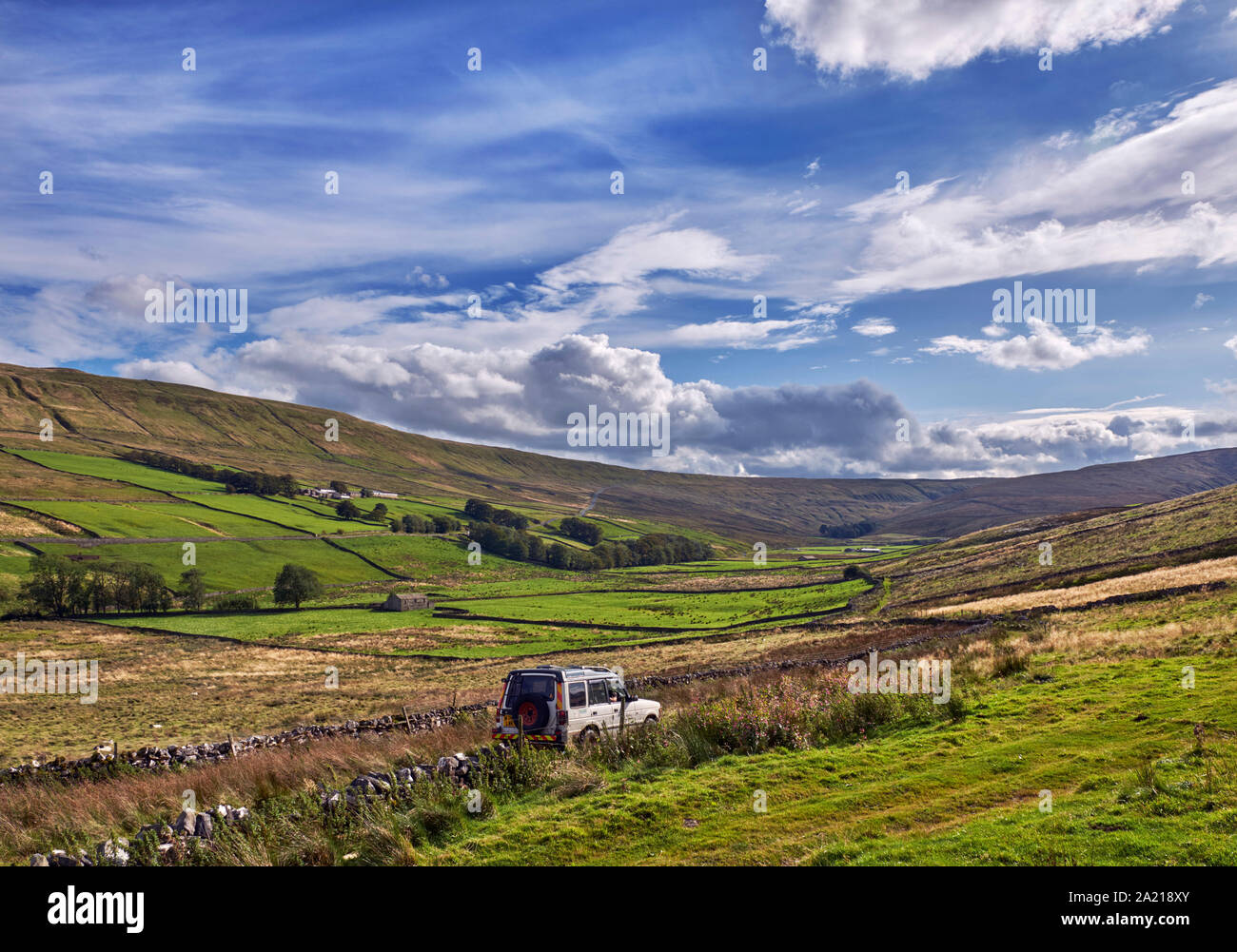 Car on unsurfaced road south of Hawes. Yorkshire Dales National Park, England. Stock Photo