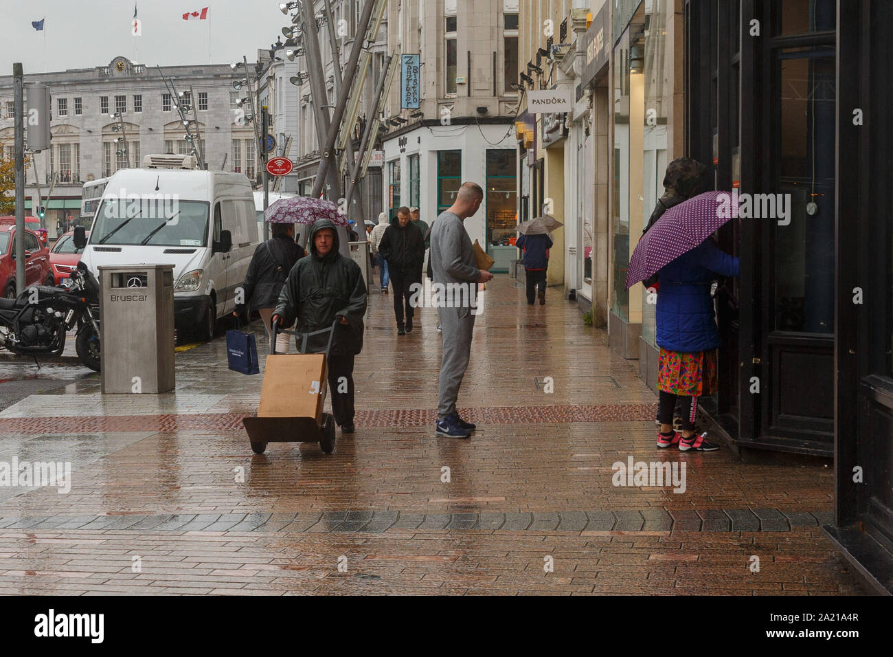 Cork, Ireland, 30th September 2019.   Yellow Weather Warning, Cork City. The status yellow weather warning for rain throughout the county didnt stop some shoppers from getting to the city today. The warning is in place till 4pm, this is ahead of Storm Lorenzo which may hit Thursday according to some forecasts.  Credit: Damian Coleman Stock Photo