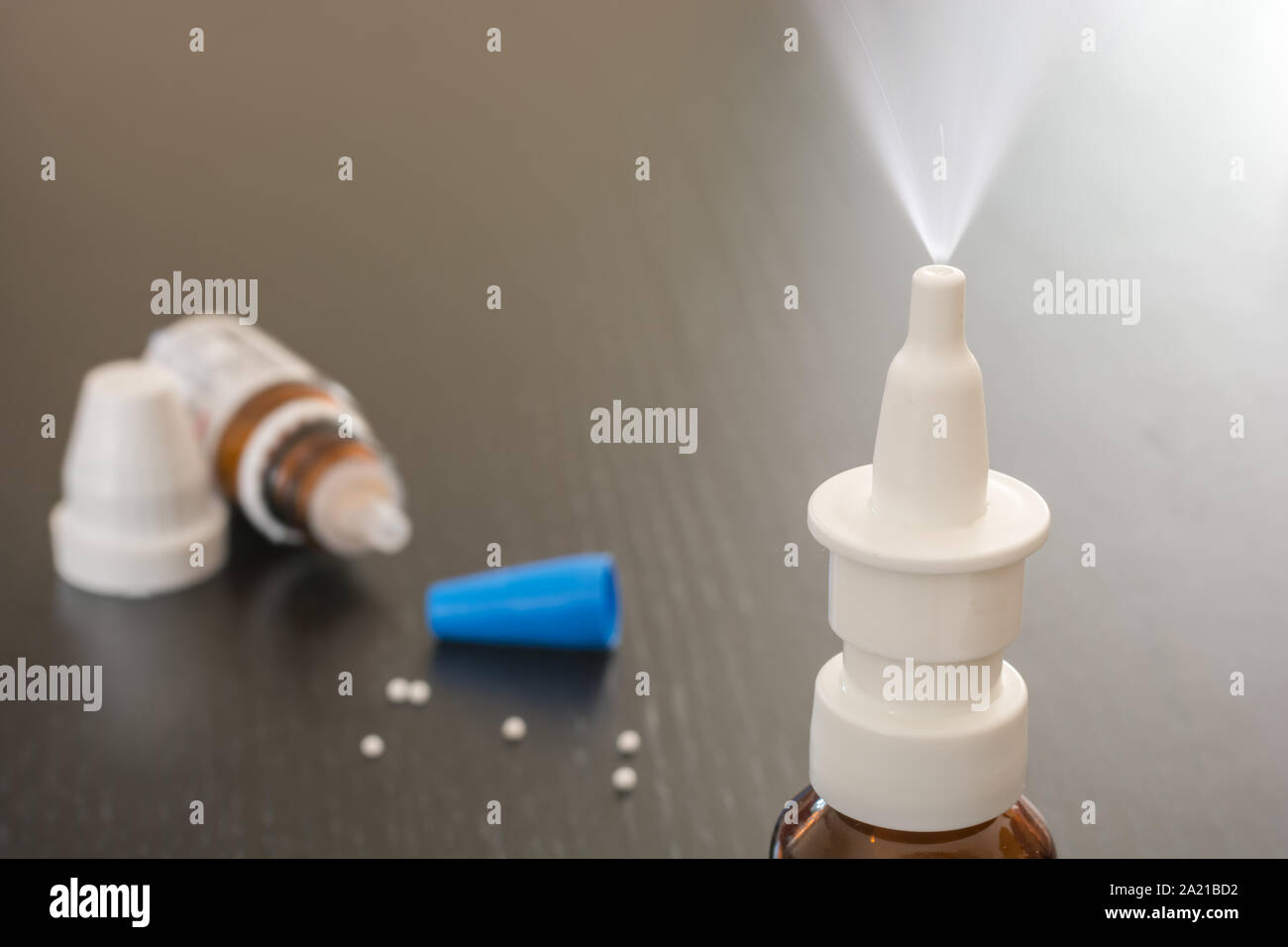 Snuff spray and homeopathic medicine in the cold period Stock Photo