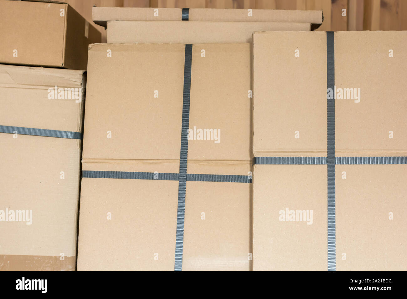 Stacked cardboard boxes in a warehouse Stock Photo