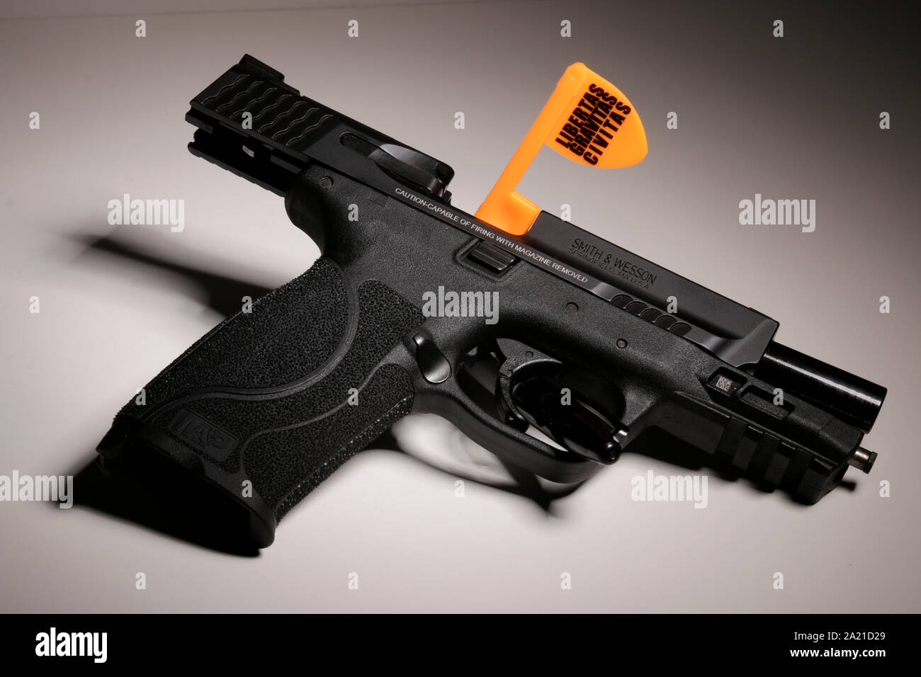 Pistol with Liberal Gun Club 'Libertas, Gravitas, Civitas'  Chamber Flag Stock Photo