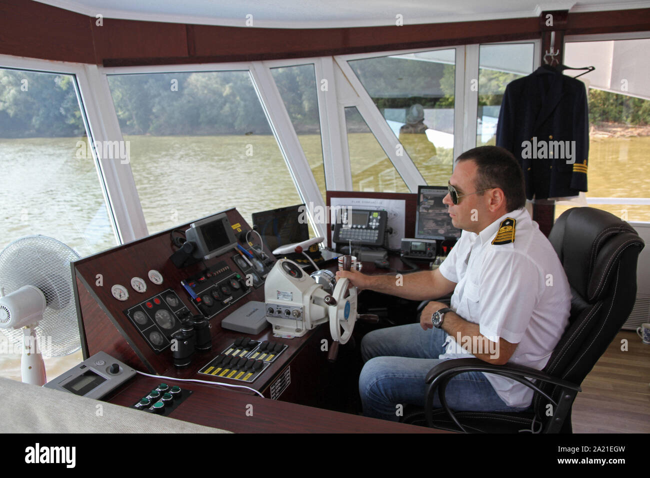 Captain driving boat hires stock photography and images Alamy