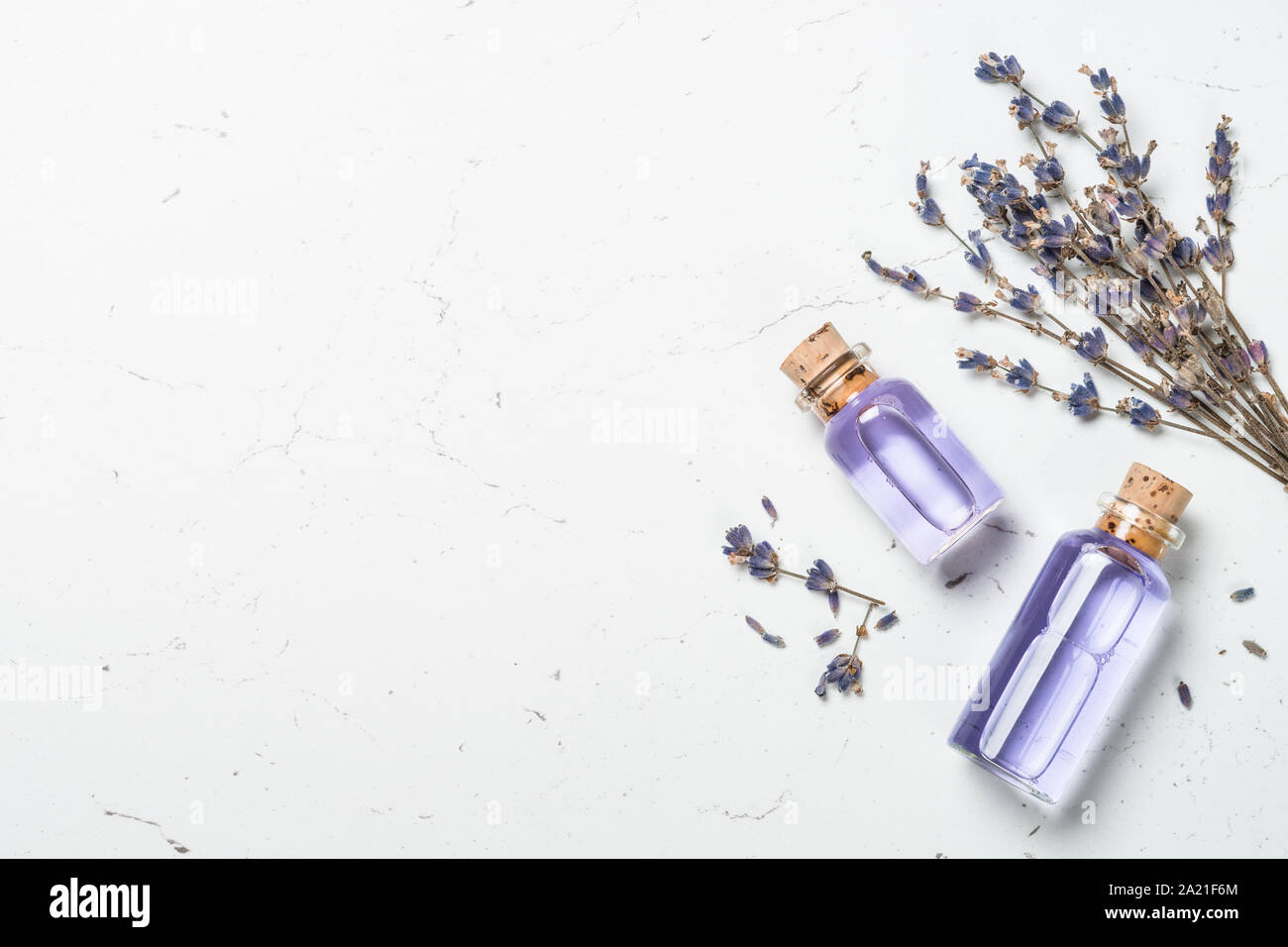 Lavender essential oil on white Stock Photo - Alamy