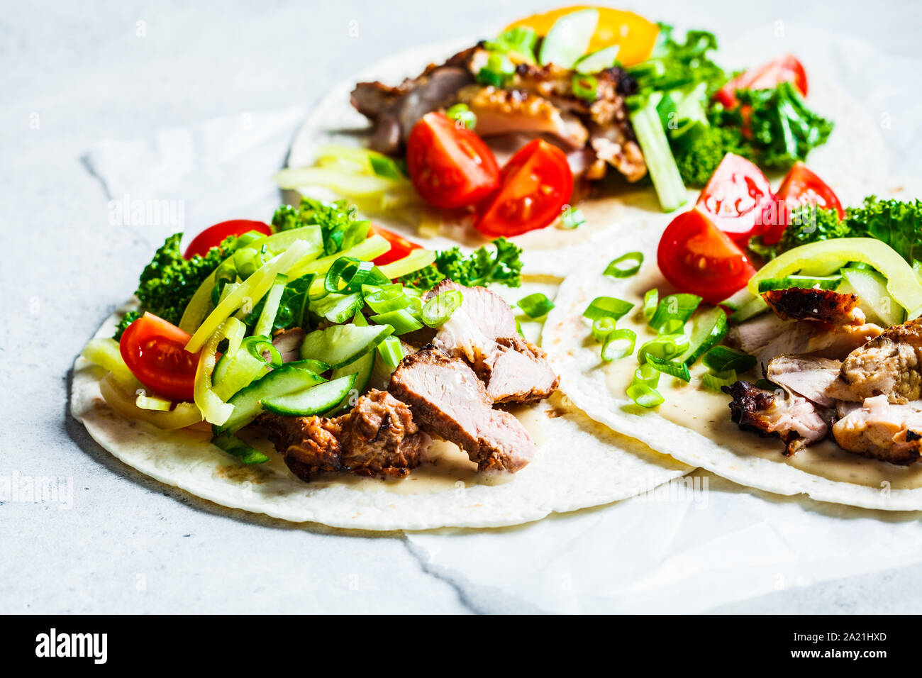 Healthy mini tortillas with grilled chicken, meat, sauce, fresh