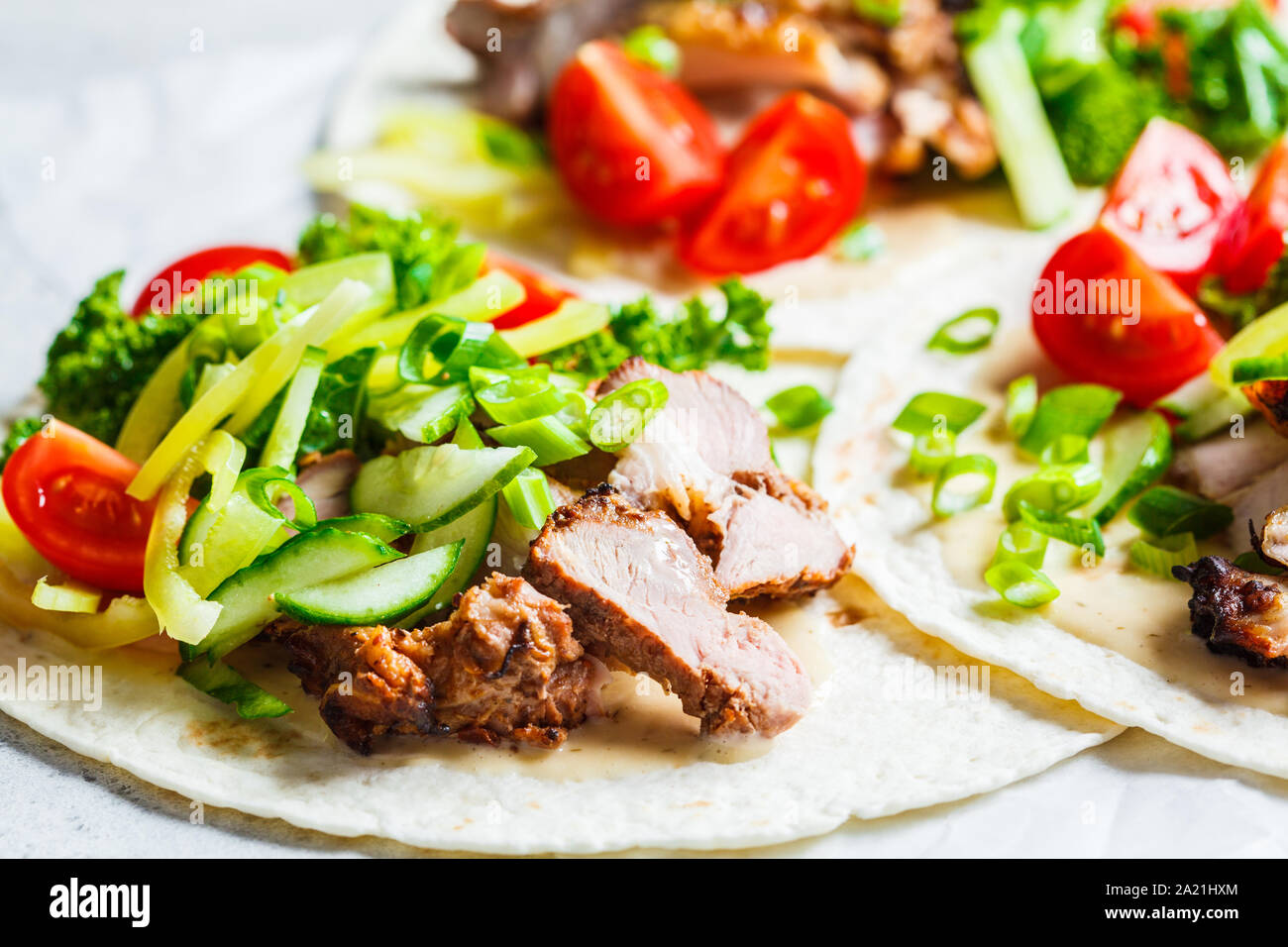 Healthy mini tortillas with grilled chicken, meat, sauce, fresh