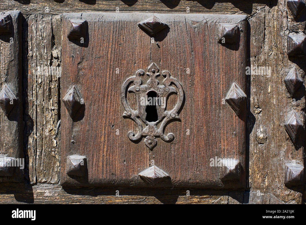 Antique wooden door with a medieval lock. Stock Photo
