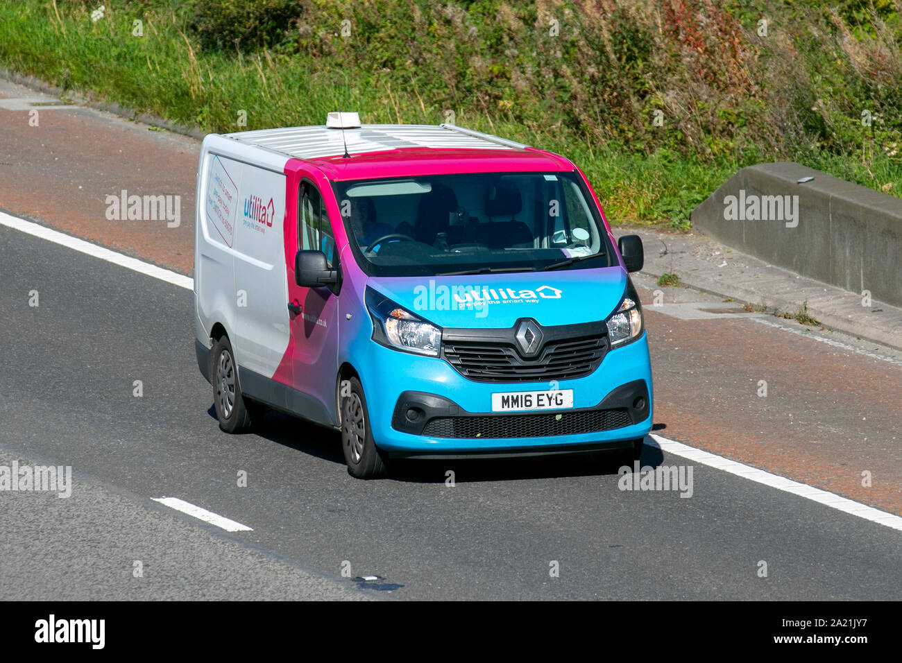2016 Renault Trafic Sl27 Business+ NRG; Utilita vehicle travelling on the M6 at Lancaster, Stock Photo
