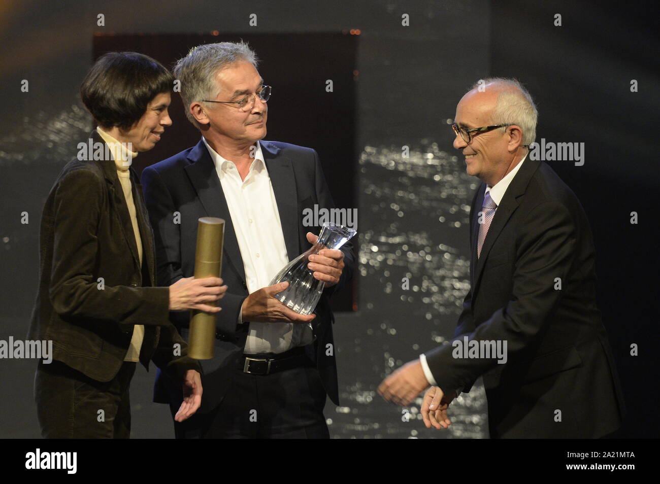 The category Czech Crystal or Documentaries on Music, Dance and Theatre was won by the German film Unanswered Ives, in which the director, Anne-Kathrin Peitz, introduces U.S. composer Charles Ives. The Price receives PAUL SMACZNY (centre) of Accentus Music GmbH at the Golden Prague international television festival in Prague, Czech Republic, September 28, 2019.  (CTK Photo/Katerina Sulova) Stock Photo