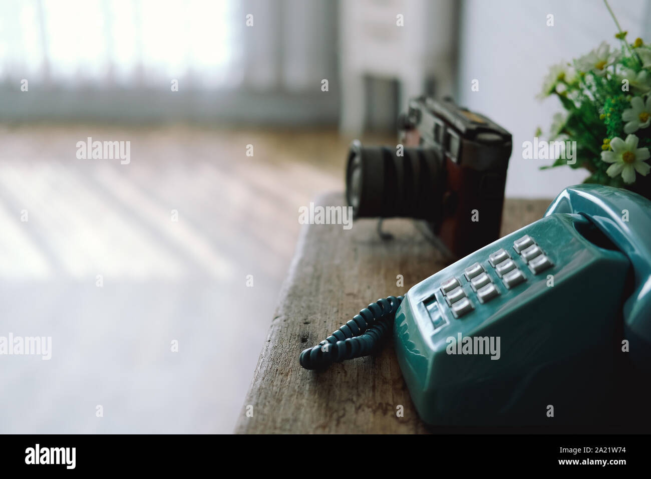 vintage old retro telephone camera on wooden desk Stock Photo - Alamy