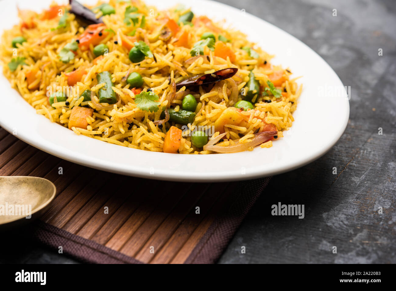 Tawa Pulao/Pulav/Pilaf/Pilau is an Indian Street Food  made using basmati rice, vegetables and spices. Selective focus Stock Photo
