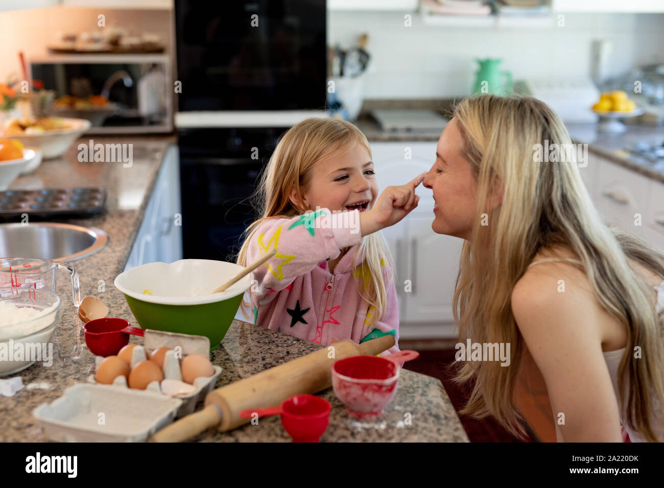 Family making Christmas cookies at home Stock Photo
