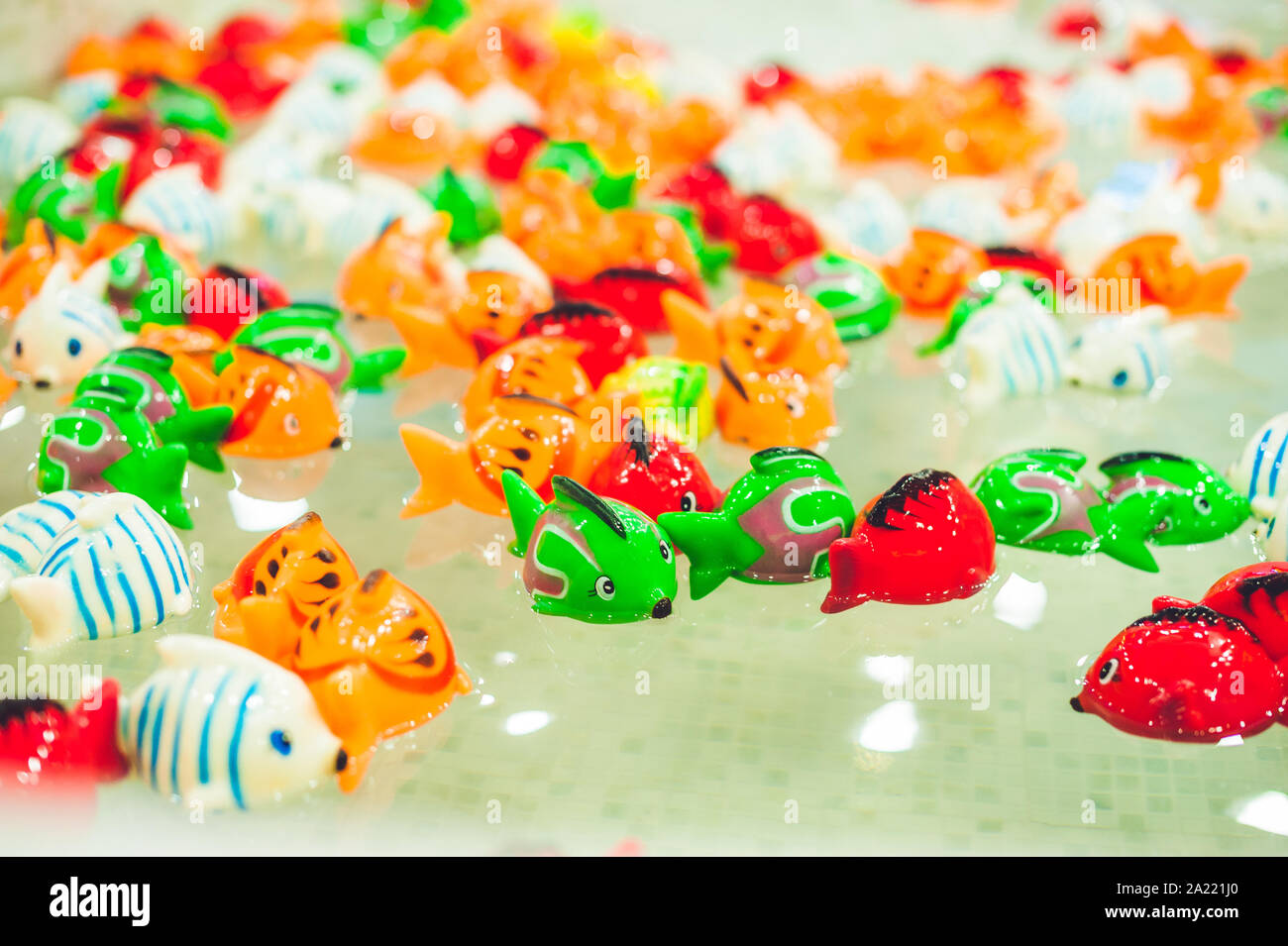 Toy, fake Beautiful colorful fish in the pond Stock Photo Alamy