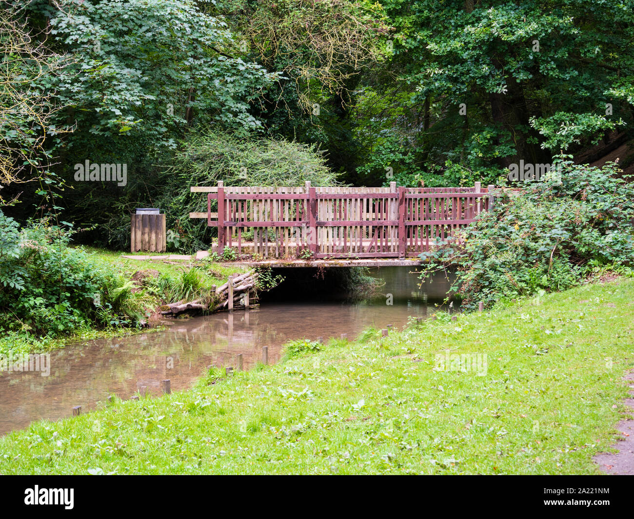 Slatted wooden bridge over the River Lud at Hubbard's Hills, Louth,Lincolnshire Stock Photo