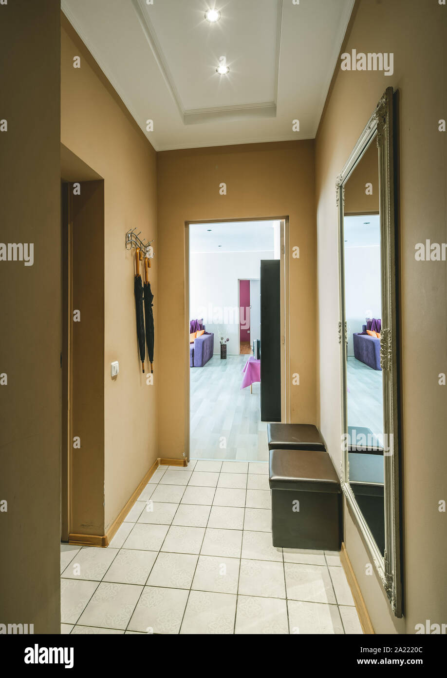 Hallway In Beige Tones Umbrellas Mirror On The Wall Stock