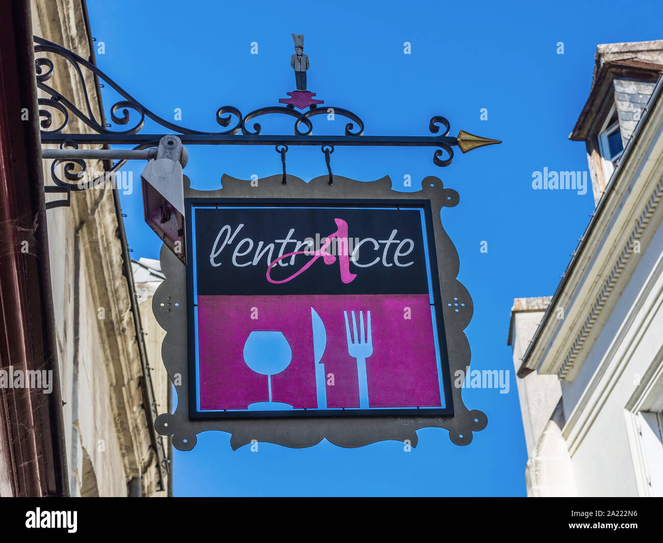Decorative painted metal hanging sign for café restaurant - Loches, Indre-et-Loire, France. Stock Photo