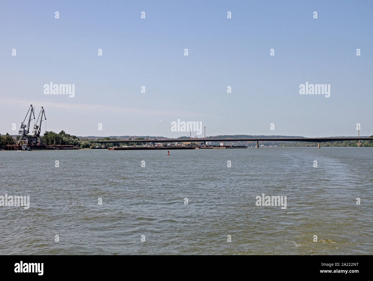 Loading cranes on loading docks on the Danube River, next to bridge 14, Kovin, Serbia. Stock Photo