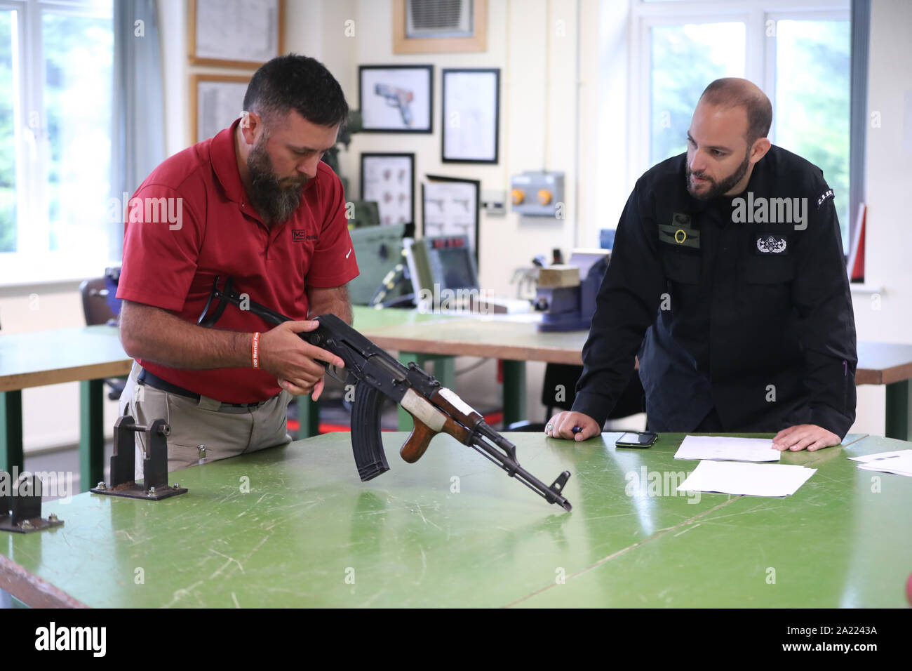 Students are instructed on how to disassemble a Kalashnikov during the Nato Commanders Counter Marauding Terrorist Attack (CCMTA) training Course at the Curragh Camp in Kildare. Stock Photo