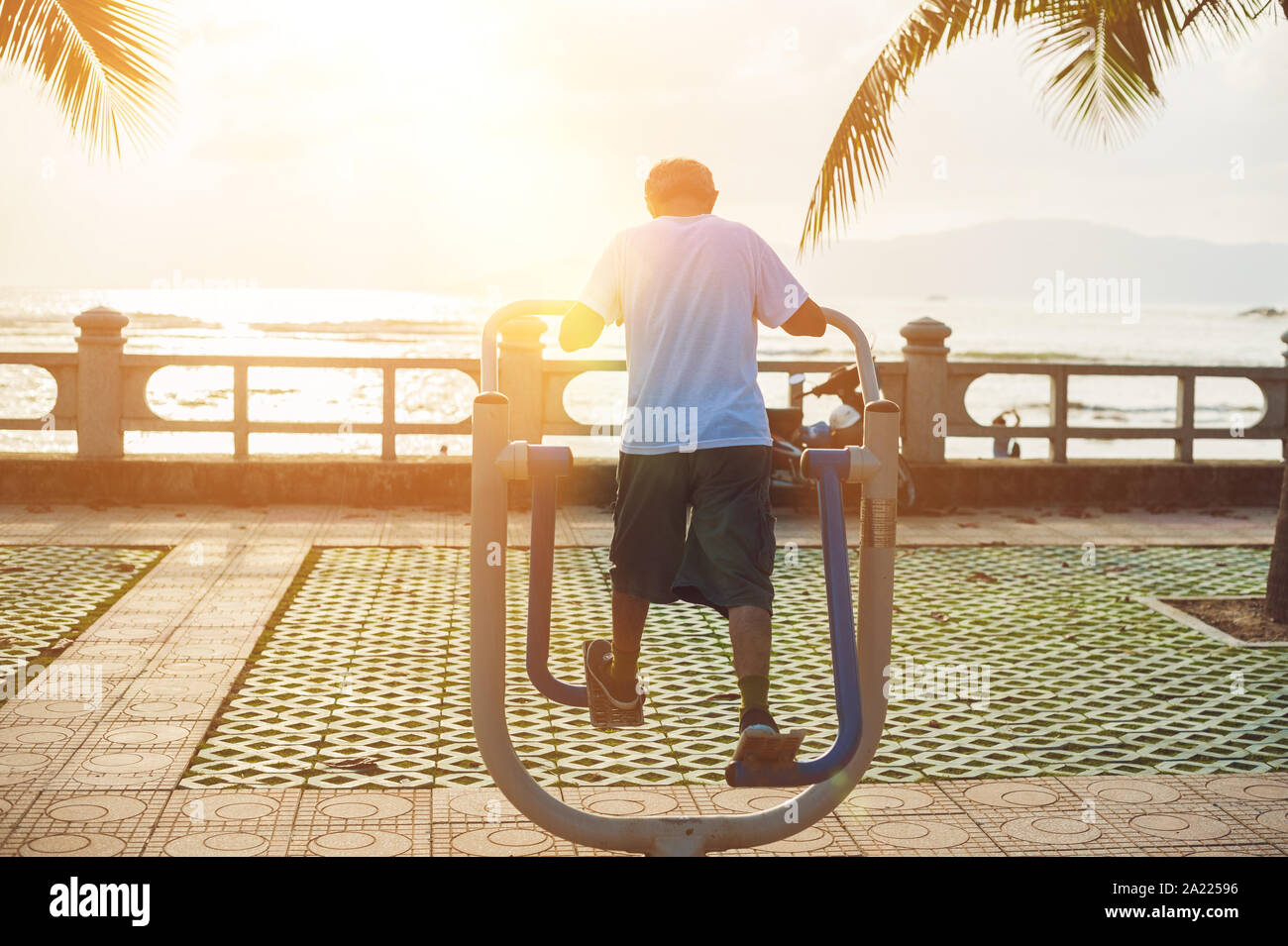Man doing sports at the sea's, sunset Stock Photo