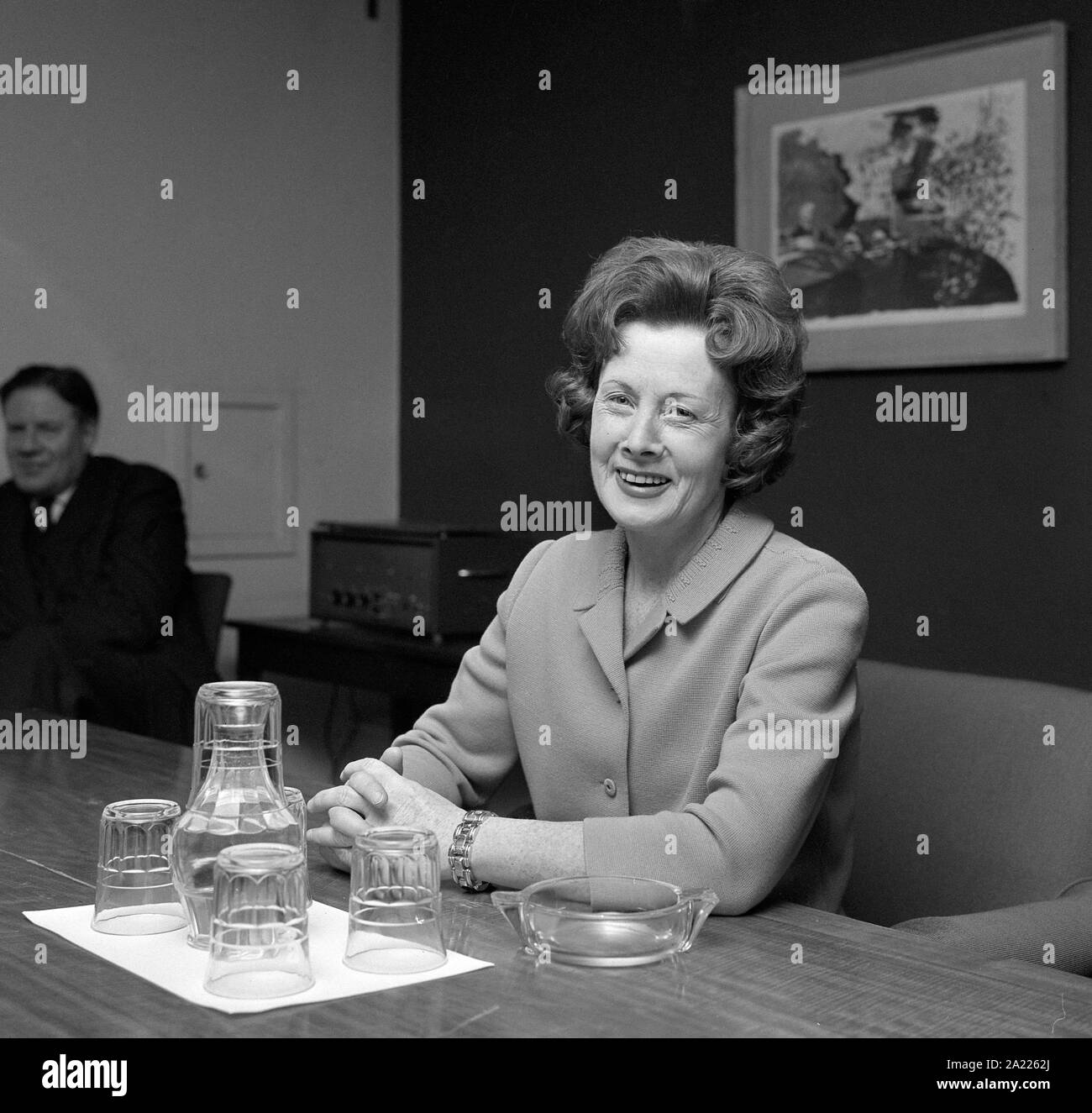 A smiling Barbara Castle, Britain's first-ever Woman Minister of Transport, in her office at the Ministry of Overseas Development in Victoria, London, after the announcement of Harold Wilson's Cabinet reshuffle. Mrs Castle was formerly Minister of Overseas Development but now replaces Tom Fraser, who has resigned from the Government. Stock Photo