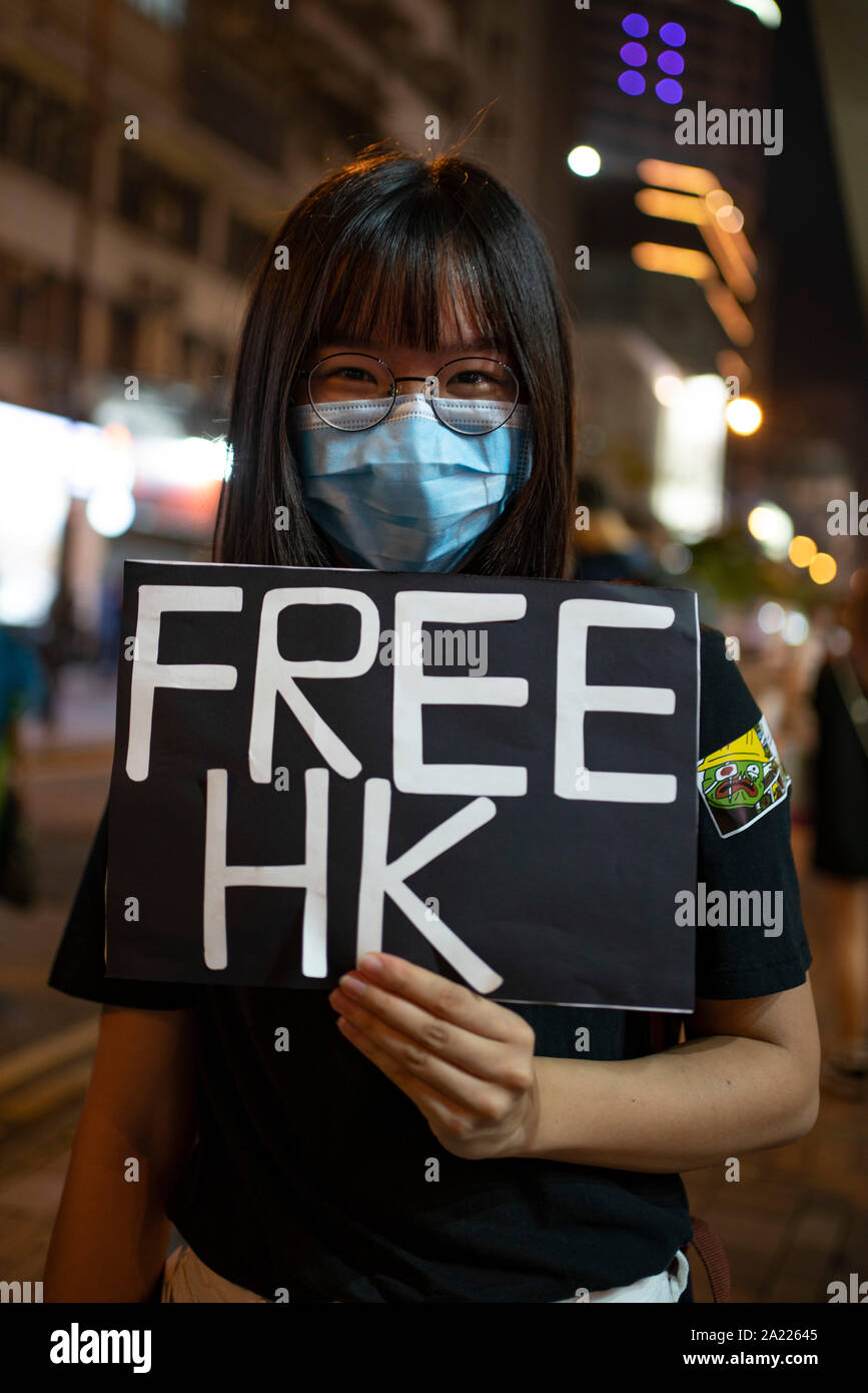 Hong Kong. 30 September, 2019. Peaceful protest held in Tsim Sha Tsui district of Kowloon tonight. Using the frog Pepe, which is a symbol of the pro-democracy movement in the city, protestors formed a human chain stretching along busy Nathan Road.  Iain Masterton/Alamy Live News. Stock Photo